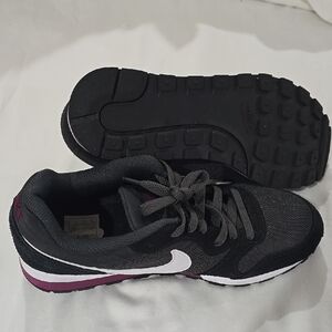 Nike Black and Purple Athletic Shoes with Sleek Design